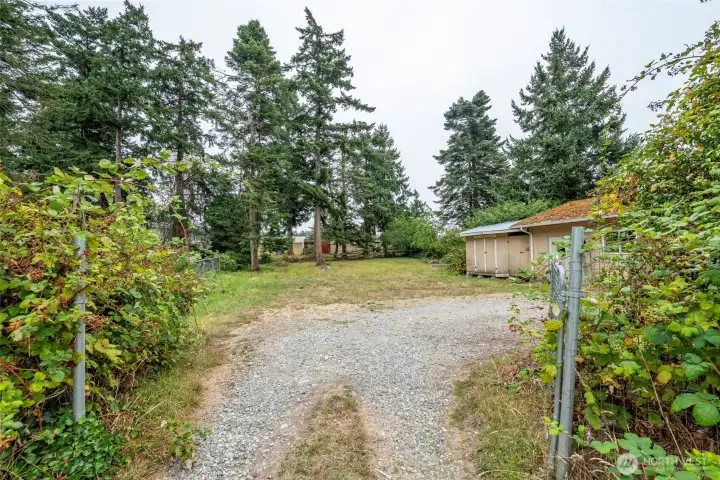 Driveway leading to back yard.