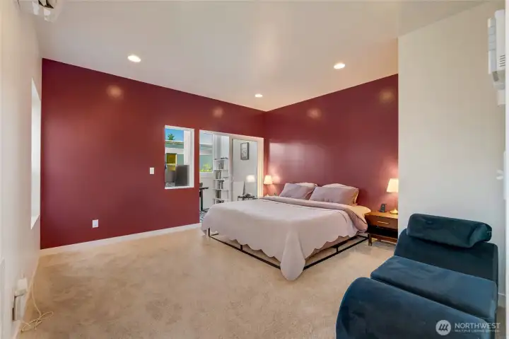 Upstairs, the generous third-floor primary suite offers a true retreat, complete with a light-filled office or flex space surrounded by windows — perfect for remote work or your favorite hobbies
