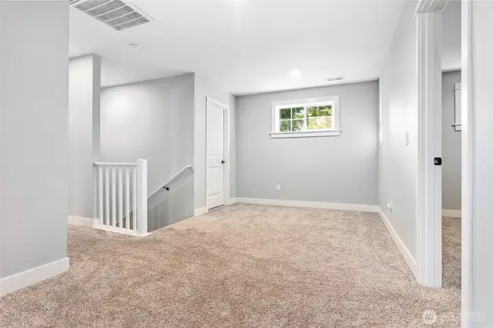 Family Room upstairs.(Mechanical room behind door on left)