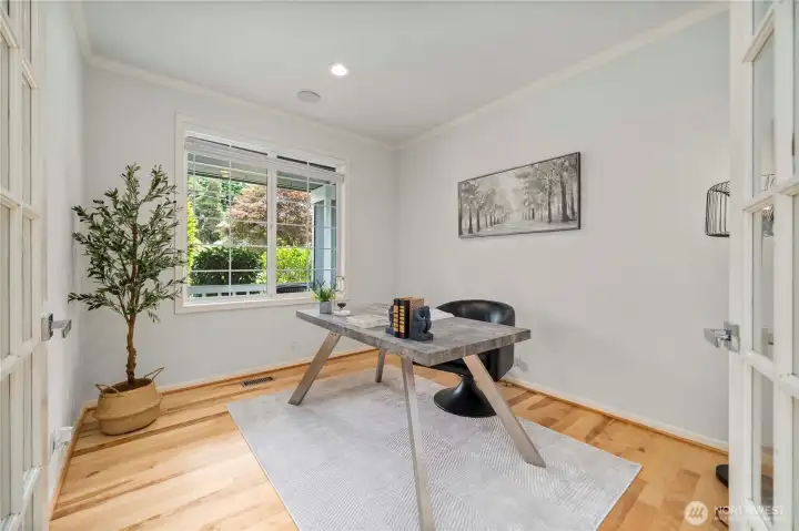 A private home office is conveniently located just off the entryway