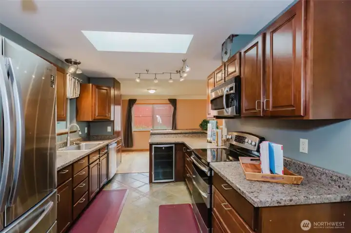 Abundant cabinetry and generous prep areas with updated countertops.