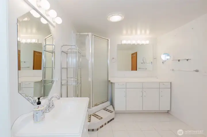 Updated lower-level bath with modern vanity and flooring