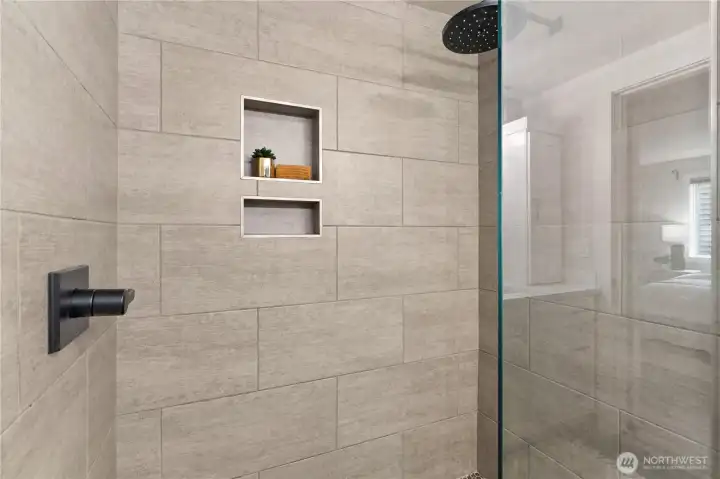 Imagine waking up to this tiled walk-in rain shower!