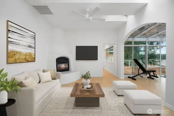 Cozy gathering area off of kitchen with gas fireplace