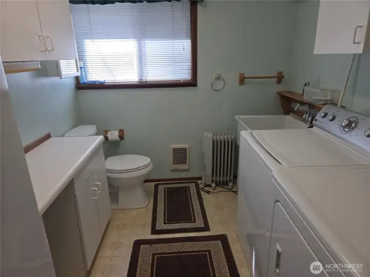 Laundry room, with half bath and extra storage