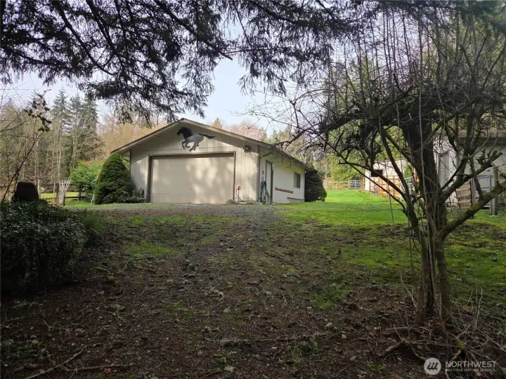 View of garage coming up the path from the house