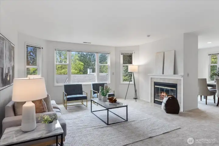 Living Room with wood fireplace opens to dining room