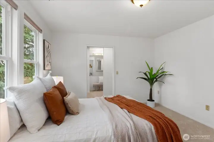 Primary suite leading to walk thru closet leading to bathroom