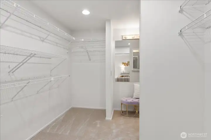 View from inside walk in closet toward bathroom