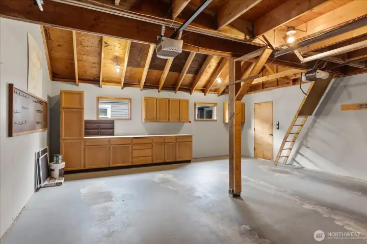 2 car garage with built in cabinets and work bench