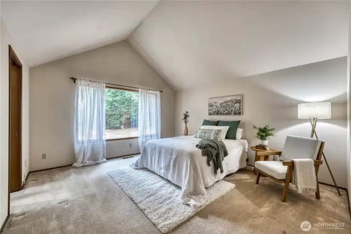 primary bedroom with valuted ceilings