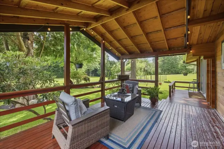 All weather deck- enjoy the beautiful yard rain or shine All weather deck- enjoy the beautiful yard rain or shine