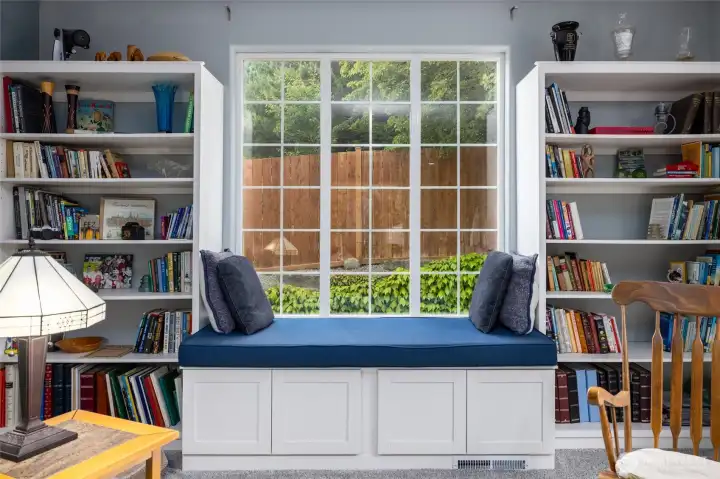 This charming window seat offers extra storage below and an inviting spot to read a good book.