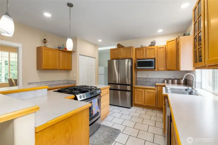 Stainless appliances, tile floor, large pantry.  What a great kitchen!