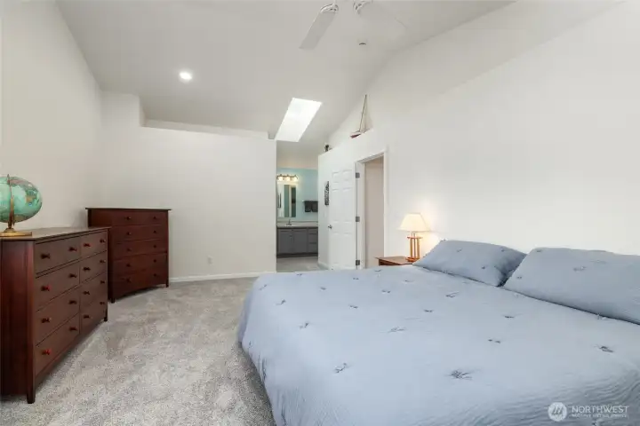 Primary suite, looking toward the closet and private bath.