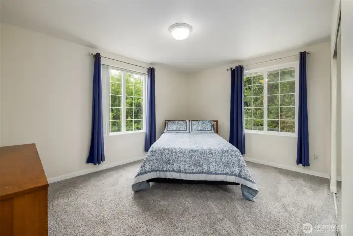 One of 3 guest rooms, this spacious corner bedroom has plenty of light, large closet.