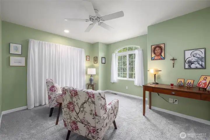 Third of three guest rooms, currently used as a place for reflection. Three guest rooms offers the flexibility to have a home office, den, or craft/play space.