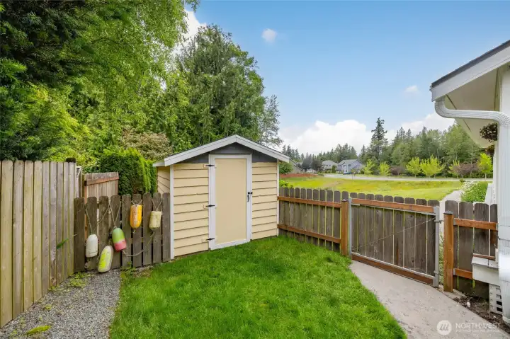 This cute garden shed can hold your yard tools, or use it as a playhouse or for outdoor furniture storage.