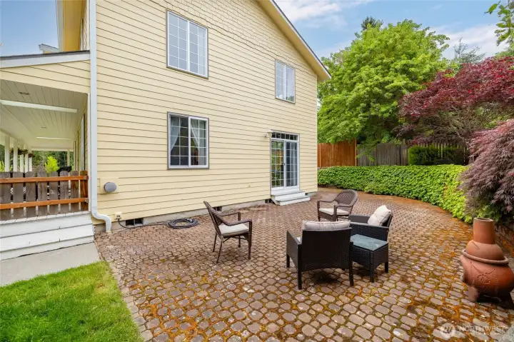 Fabulous paver patio with "living" base - the moss holds the sand in place and offers a soft and cool counterpoint to the pavers.