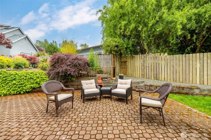 Patio area, with terraced garden beyond.