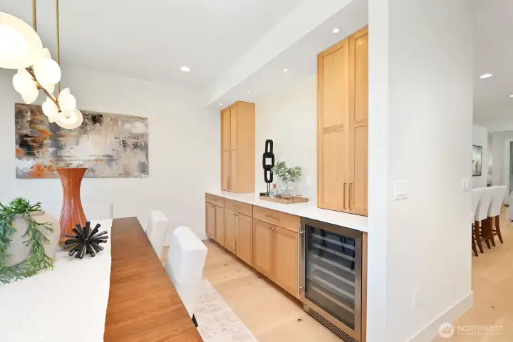 Close up of the built in buffet with tons of storage, wine cooler and tile wall. No worries about wheere to store all of your holiday dinner ware!