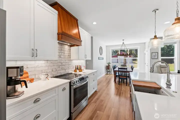 Quartz countertops, custom sink on the island, open cooking space with large quart counter-top.