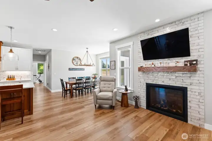 Propane fireplace with custom hearth and tile welcomes you into the family room.