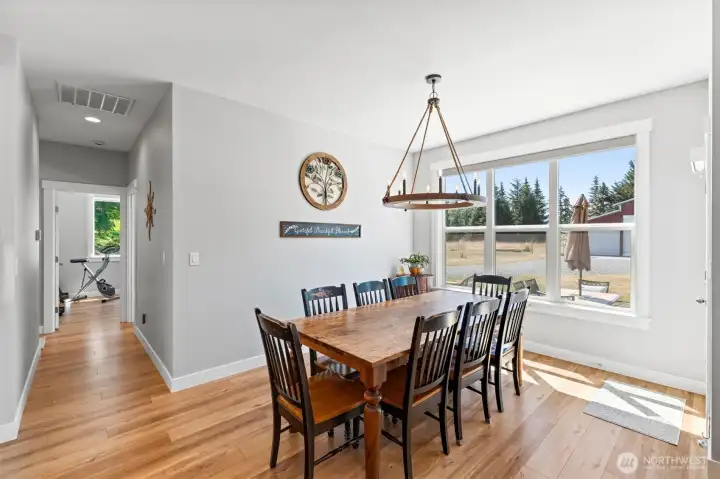 Large dining area with views onto the back of the property.