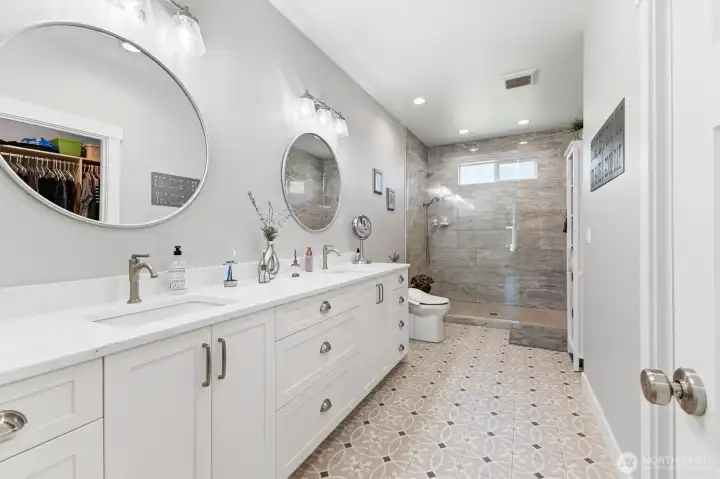 New vanities, quartz countertops and custom tile work.
