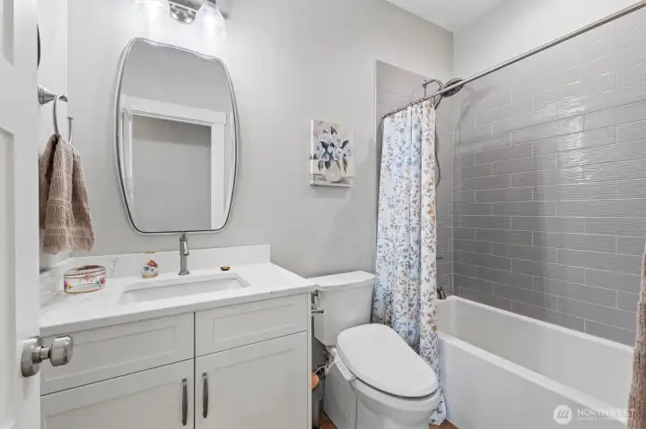 New vanities, custom tile work and quart countertops.