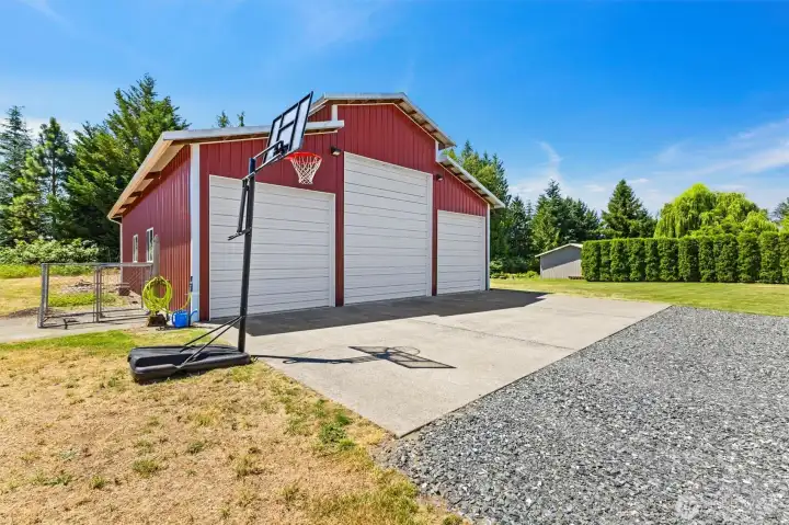 Shop with 14 ft center bay door and reinforced with heavy duty concrete. Great for parking a large RV.