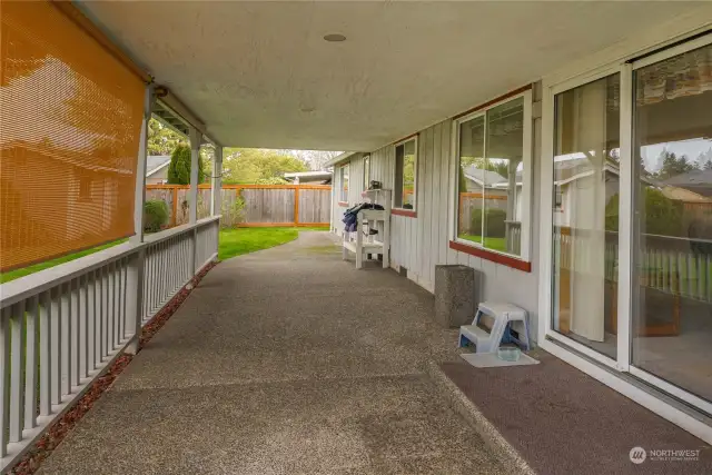 Outside the bonus room is this very large covered patio. Private location in a fully-fenced backyard.