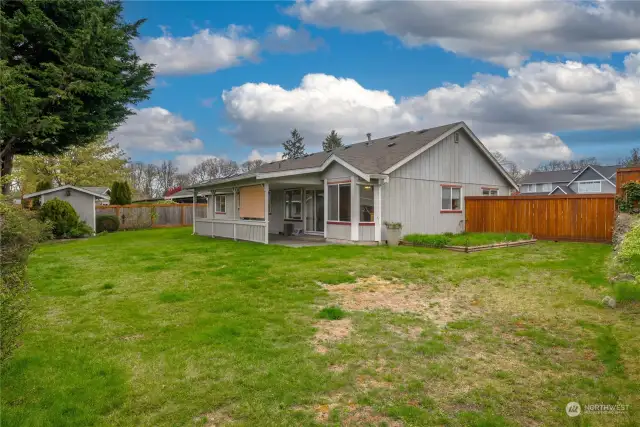 Large backyard is fully-fenced and has plenty of space for your needs.