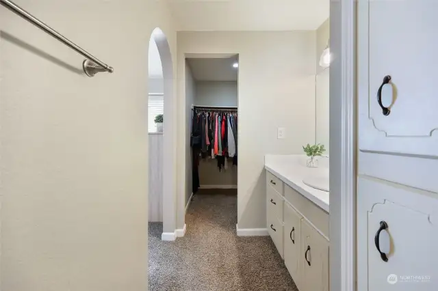 Primary side walk-in-closet seen here.