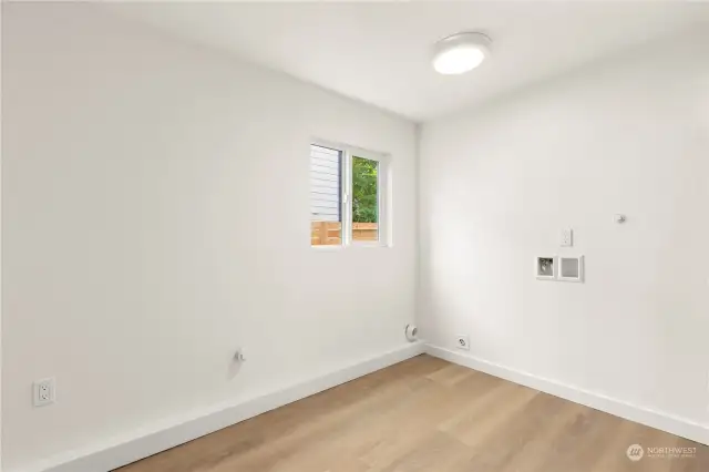 Oversized utility room downstairs with W/D hookups and furnace to the right