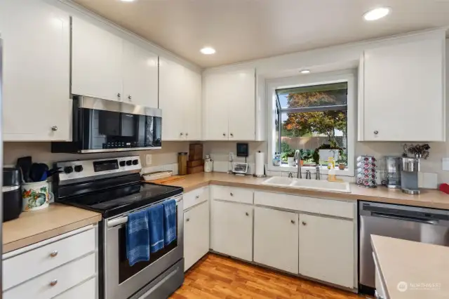 Don't forget the pop out window above the sink with a great view of the large backyard.