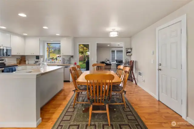 Another view of your dining space, door to the right leads to the attached garage.