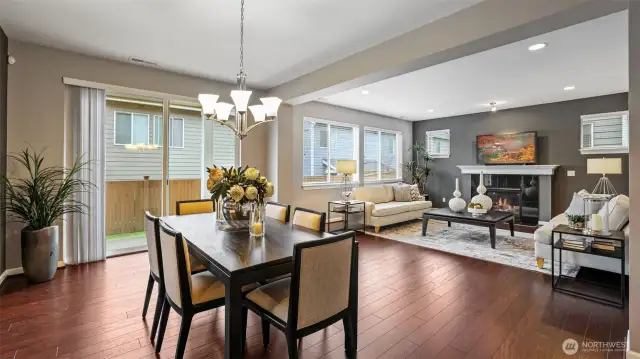 A very warm picture of the dining room looking into the family room.