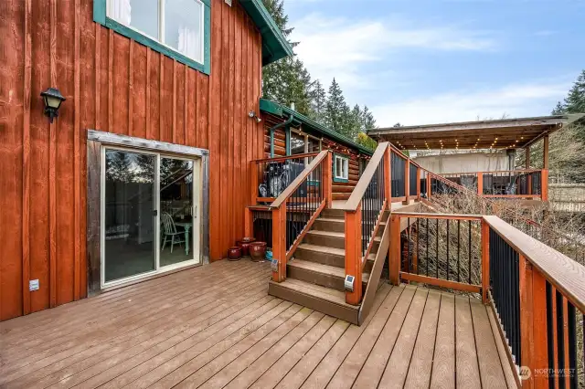 Step outside to enjoy the multi-level composite deck spanning the full length of the house, designed for relaxation and entertaining lots of guests.