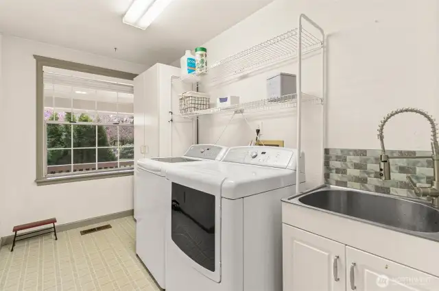 Laundry/mud room near garage door entrance.