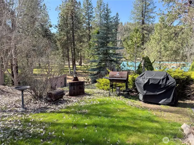 BBQ area just off of covered rear deck. Access to the deck is to the right of this picture.