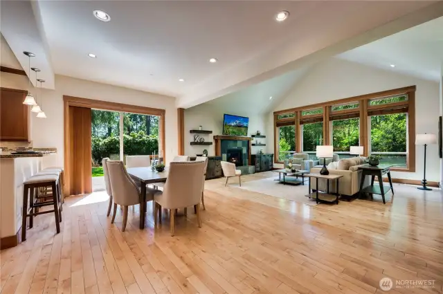 Open concept great room and dining room flooded with natural light.