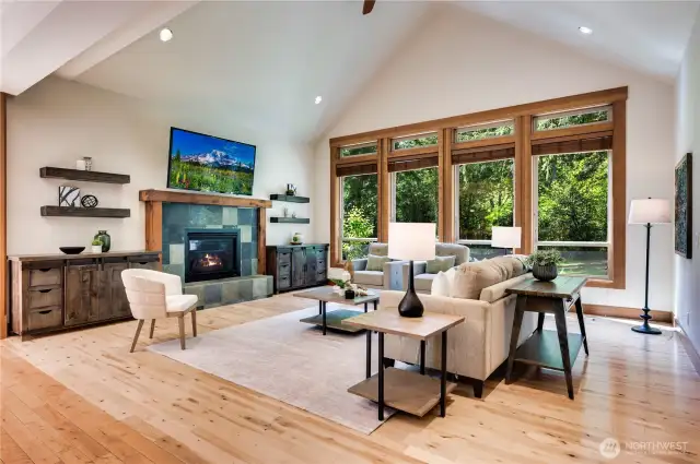 Every window in this house frames the park-like grounds and lush forest.