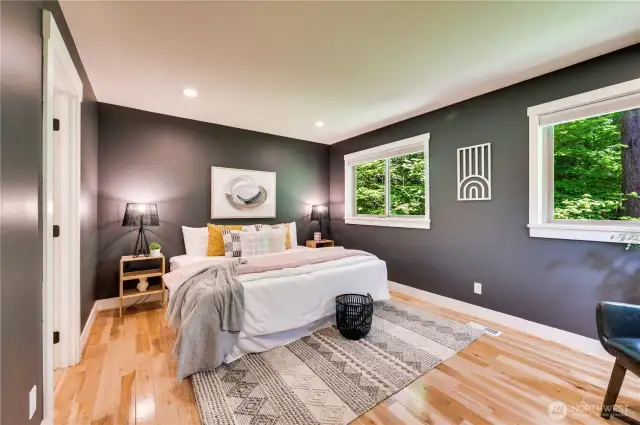 Another spacious bedroom with lovely hardwoods and an ensuite full bathroom.