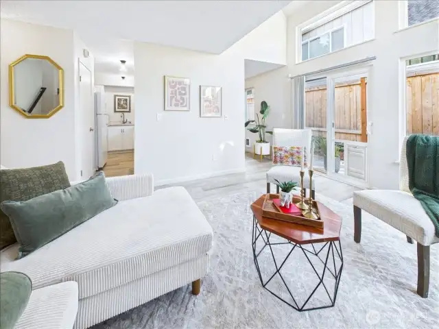 The living room has vaulted ceilings and large picture windows that let in oodles of light.