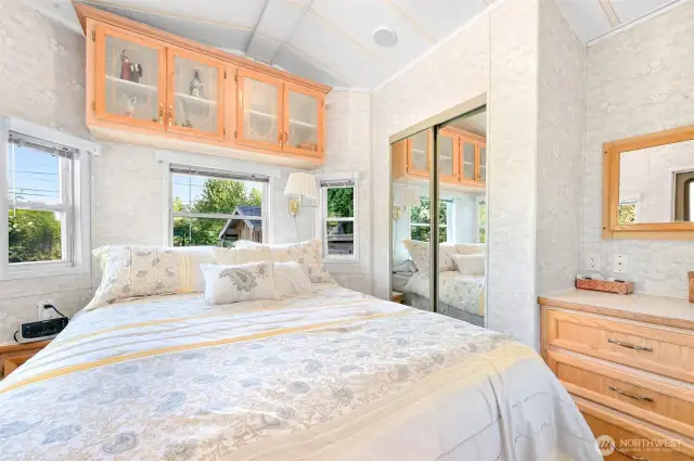 Primary bedroom on the back side of the unit, neighboring your expansive lot!