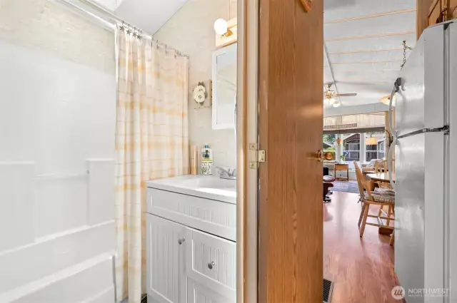 A full bathroom with a shower & a tub!
