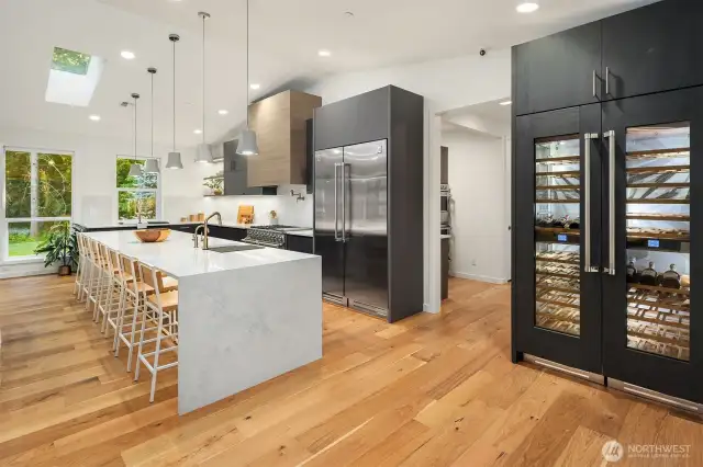 Top-tier Hestan appliance package features a 54" refrigerator/freezer, dual fuel range, 48" wine column, microwave drawer, and two dishwashers—designed for the ultimate culinary experience