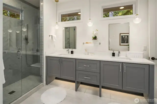 Luxurious primary suite featuring a 5-piece spa-inspired bathroom and a spacious walk-in closet