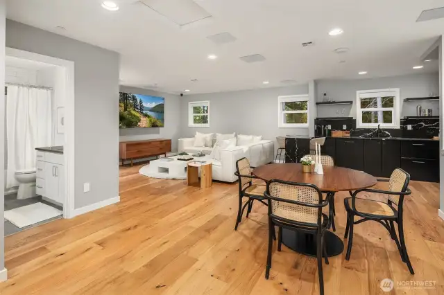 The upper level serves as a perfect flex space, featuring a bedroom, full bathroom, complete kitchen, spacious living area with theater-quality surround sound, and its own private entrance